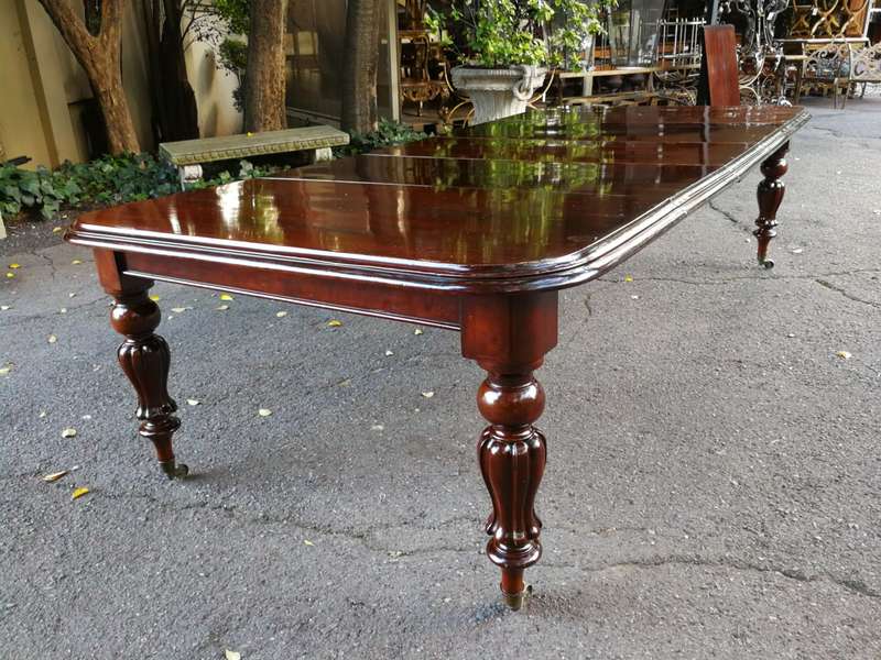 Victorian mahogany almost 3 meter twelve-seater extending dining table on castors