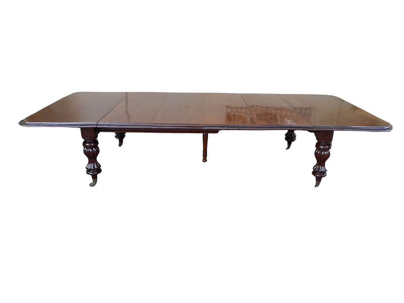 A Massive and Rare Victorian Mahogany Dining / Boardroom Extension table with Four Extensions and...
