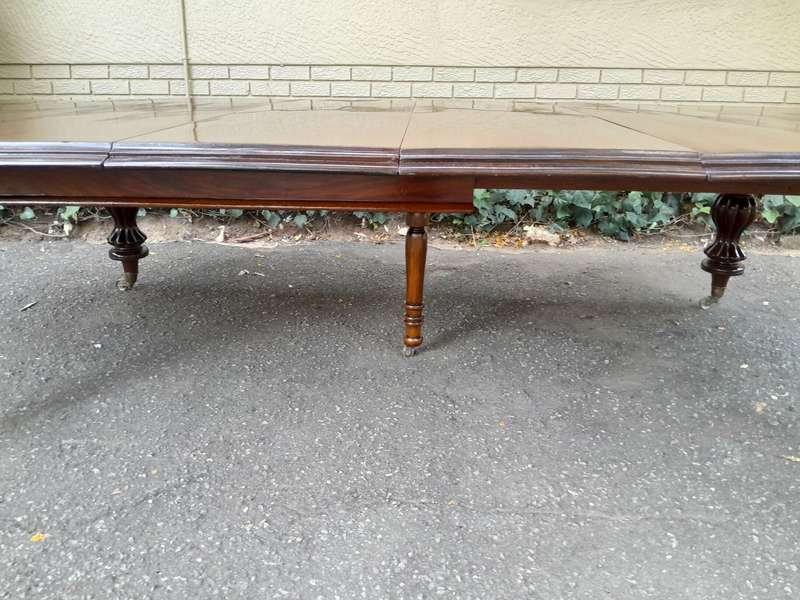 A Massive and Rare Victorian Mahogany Dining / Boardroom Extension table with Four Extensions and...