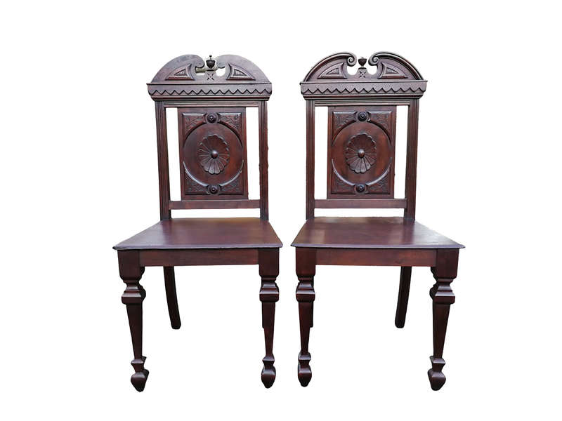 A Pair Of Victorian Mahogany Hall Chairs