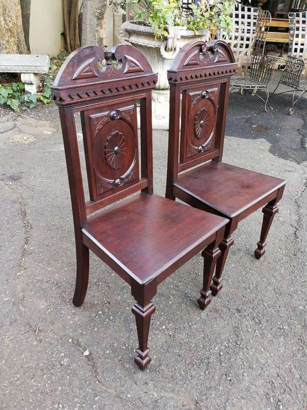A Pair Of Victorian Mahogany Hall Chairs