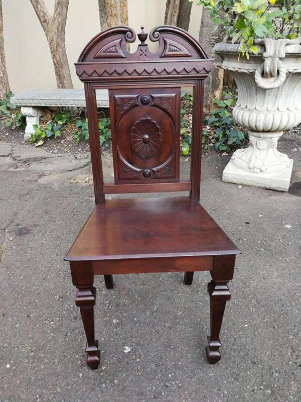 A Pair Of Victorian Mahogany Hall Chairs