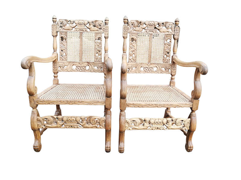 A Pair Or Ornately Carved And Bleached / Natural Wood Finish With Redone Rattan Arm Chairs