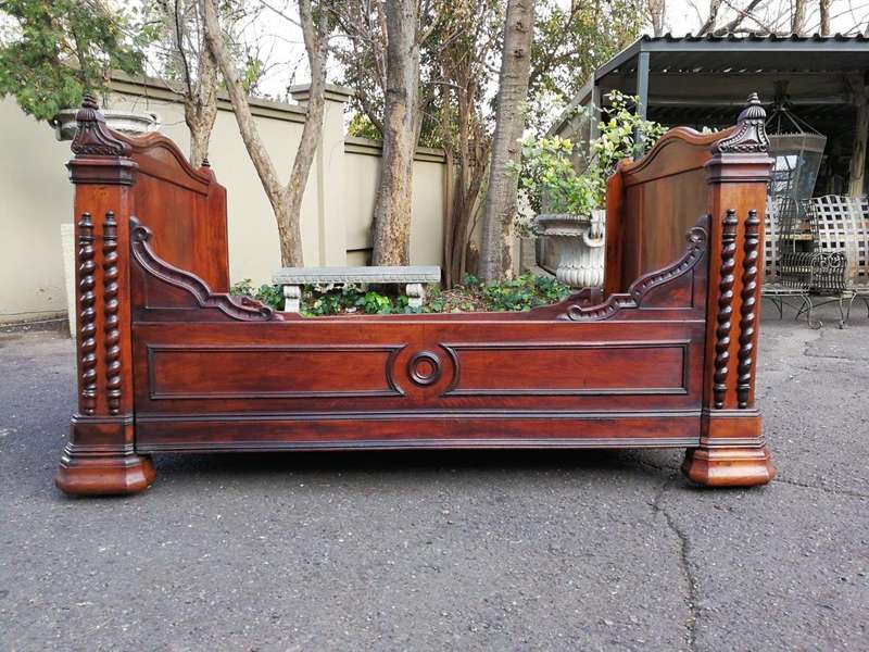 A Carved Mahogany Lit-Bateau