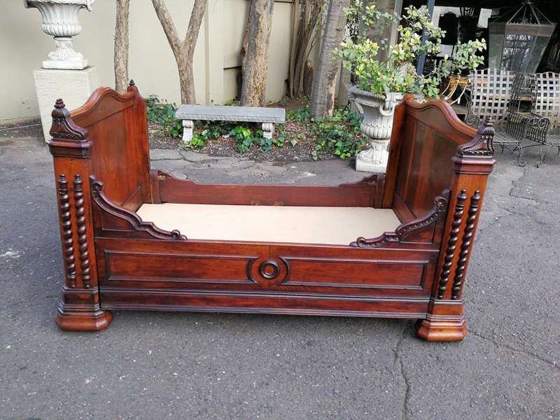 A Carved Mahogany Lit-Bateau