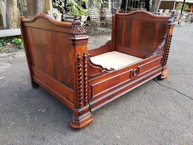 A Carved Mahogany Lit-Bateau