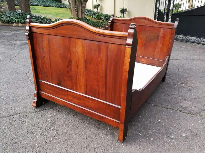 A Carved Mahogany Lit-Bateau