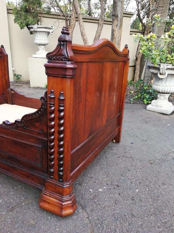 A Carved Mahogany Lit-Bateau