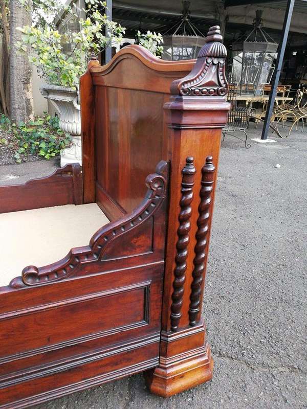 A Carved Mahogany Lit-Bateau