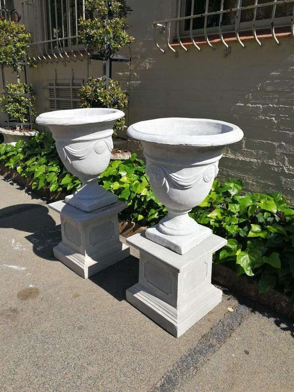 Pair Of Concrete Urns With The Plinths