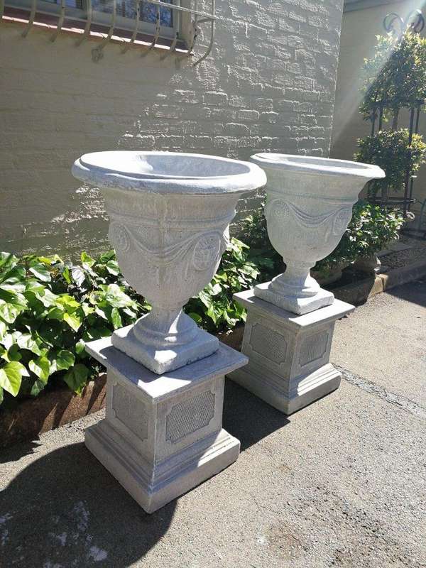 Pair Of Concrete Urns With The Plinths
