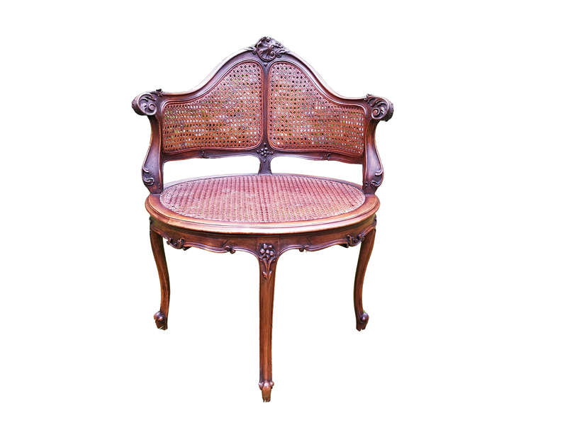 A French Walnut Carved And Rattan Chair
