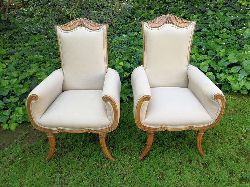 A Pair Of 1920s Bleached / Natural Carved Oak Armchairs upholstered