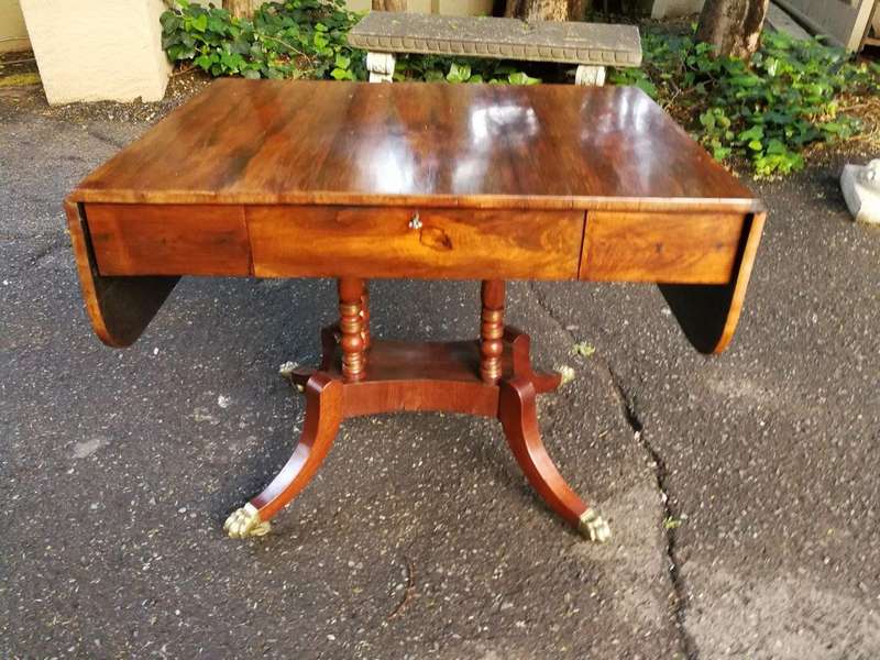 A Circa 1800 Regency Rosewood pembroke table, on castors