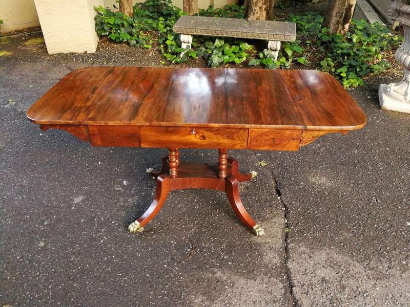 A Circa 1800 Regency Rosewood pembroke table, on castors