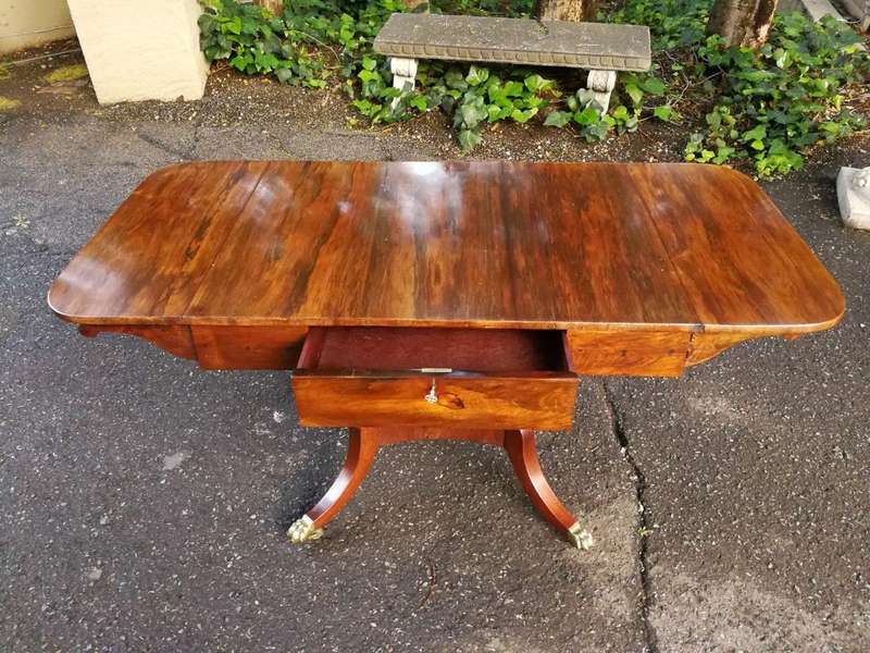 A Circa 1800 Regency Rosewood pembroke table, on castors