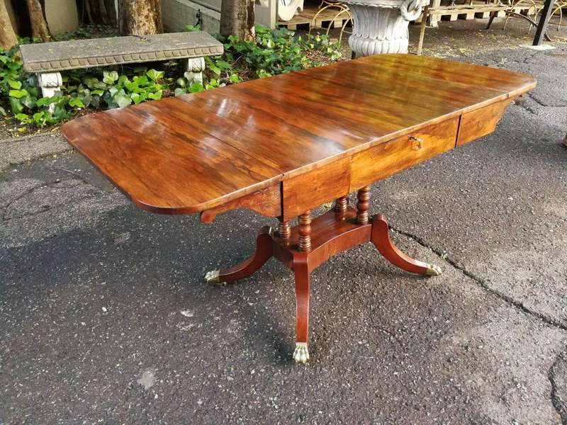 A Circa 1800 Regency Rosewood pembroke table, on castors