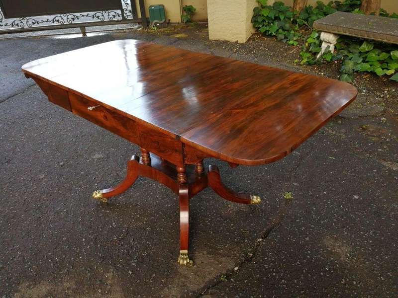 A Circa 1800 Regency Rosewood pembroke table, on castors