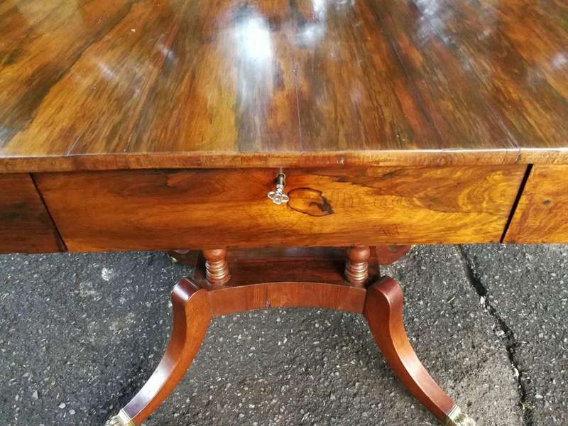 A Circa 1800 Regency Rosewood pembroke table, on castors