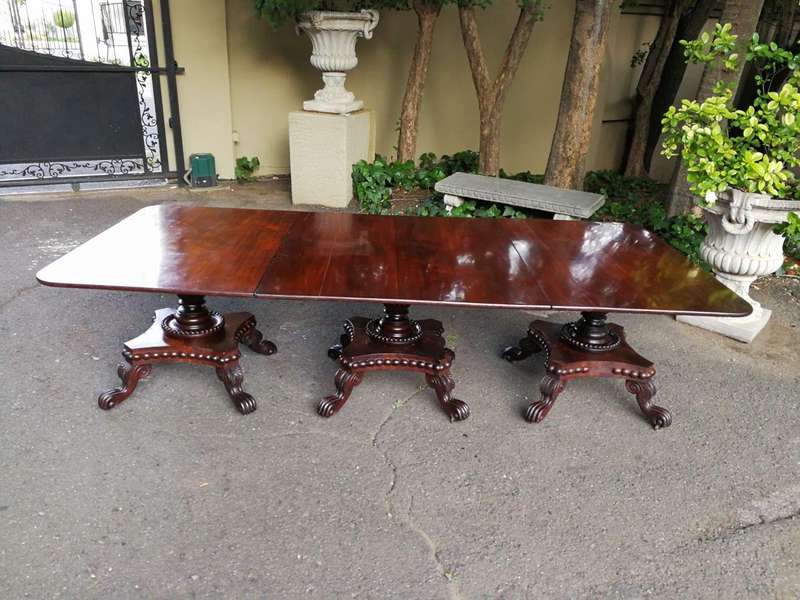 A George IV Mahogany Dining Table (Each Section Has A Tilt Top)
