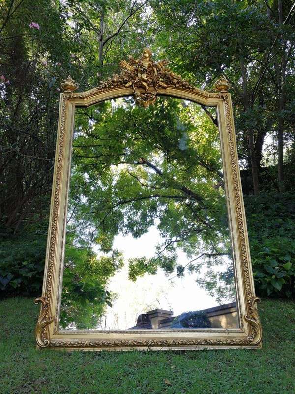 A Continental Carved Giltwood Mirror