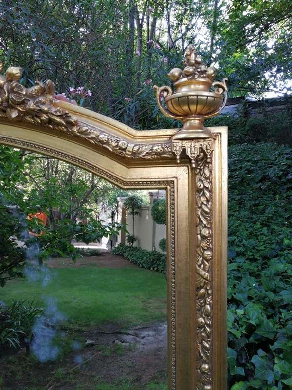 A Continental Carved Giltwood Mirror