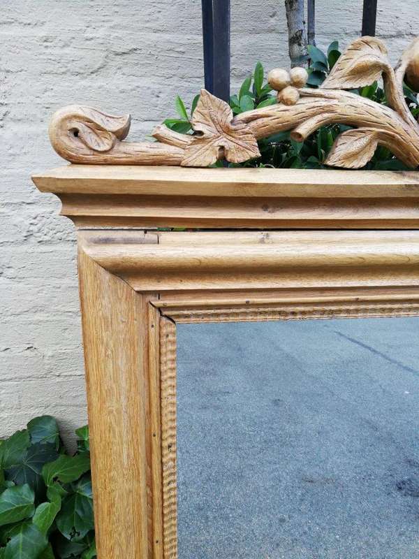 An Early 1900s (Possibly Victorian) Ornately Carved Natural Wooden Mirror