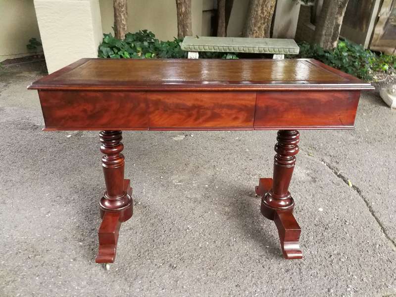 A 19th Century Flamed Mahogany Sofa / Writing Table with Leather and Hand Tooled Top On Cators