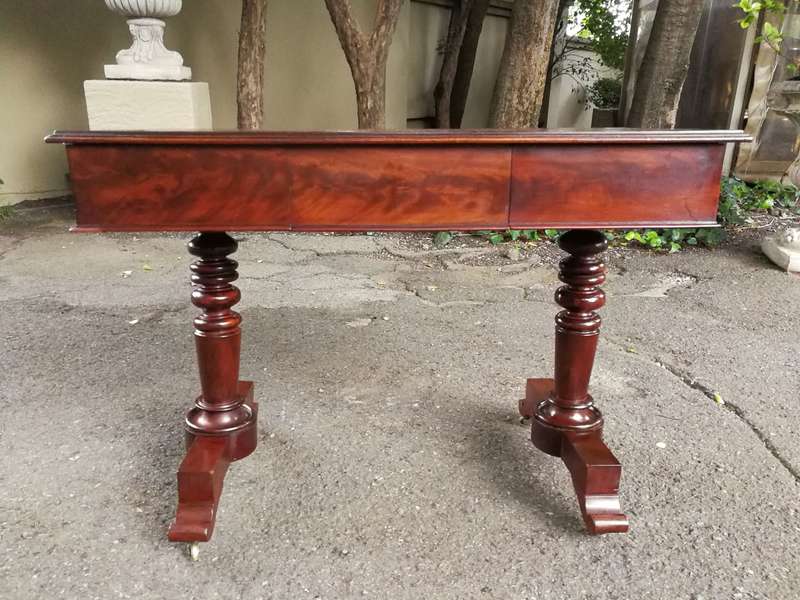 A 19th Century Flamed Mahogany Sofa / Writing Table with Leather and Hand Tooled Top On Cators
