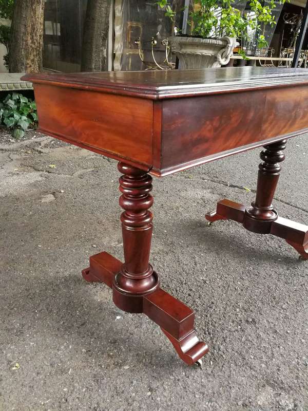 A 19th Century Flamed Mahogany Sofa / Writing Table with Leather and Hand Tooled Top On Cators