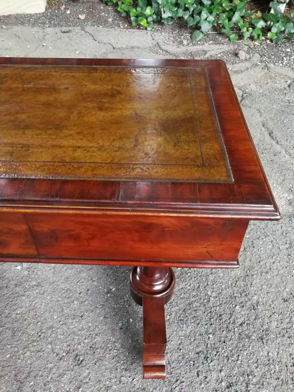 A 19th Century Flamed Mahogany Sofa / Writing Table with Leather and Hand Tooled Top On Cators