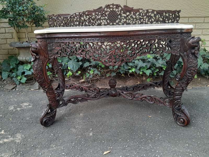 A 19th Century Anglo-Indian Carved Rosewood Serpentine Console Table With Marble Top