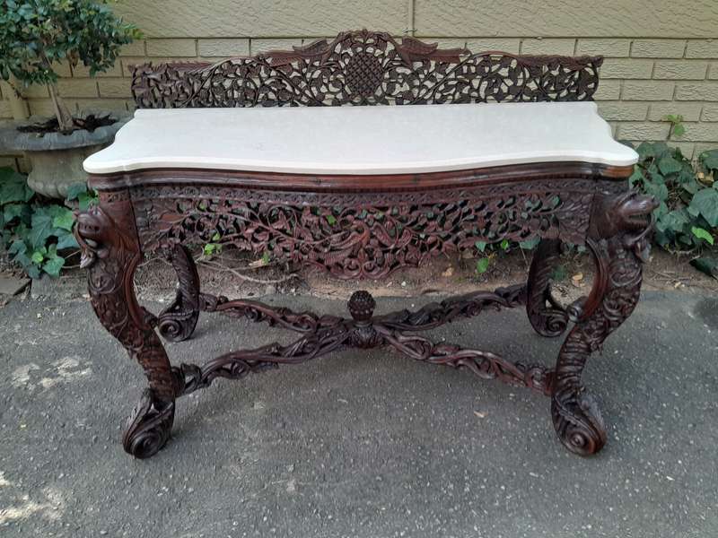 A 19th Century Anglo-Indian Carved Rosewood Serpentine Console Table With Marble Top