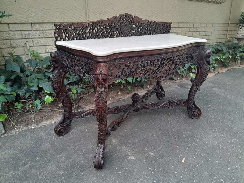 A 19th Century Anglo-Indian Carved Rosewood Serpentine Console Table With Marble Top