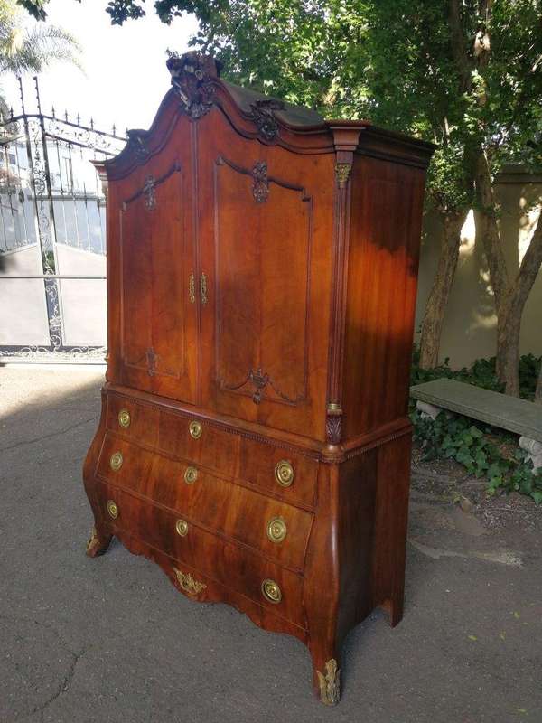 An Early 19th Century Mahogany Dutch Bombe Cabinet