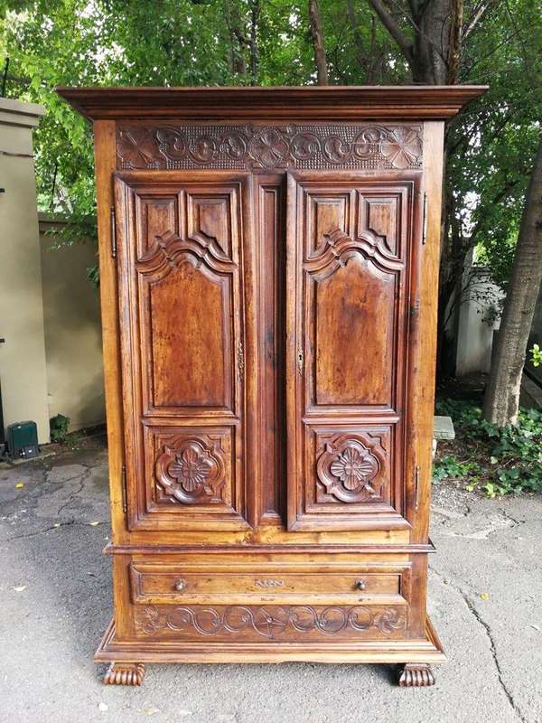 An 18th Century French Walnut Port Armoire Of Large Proportions And With Cast Iron Hinges