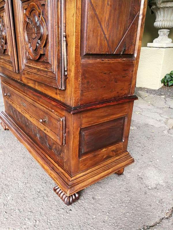 An 18th Century French Walnut Port Armoire Of Large Proportions And With Cast Iron Hinges