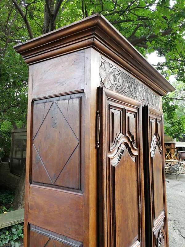 An 18th Century French Walnut Port Armoire Of Large Proportions And With Cast Iron Hinges