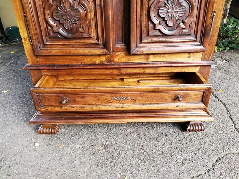 An 18th Century French Walnut Port Armoire Of Large Proportions And With Cast Iron Hinges