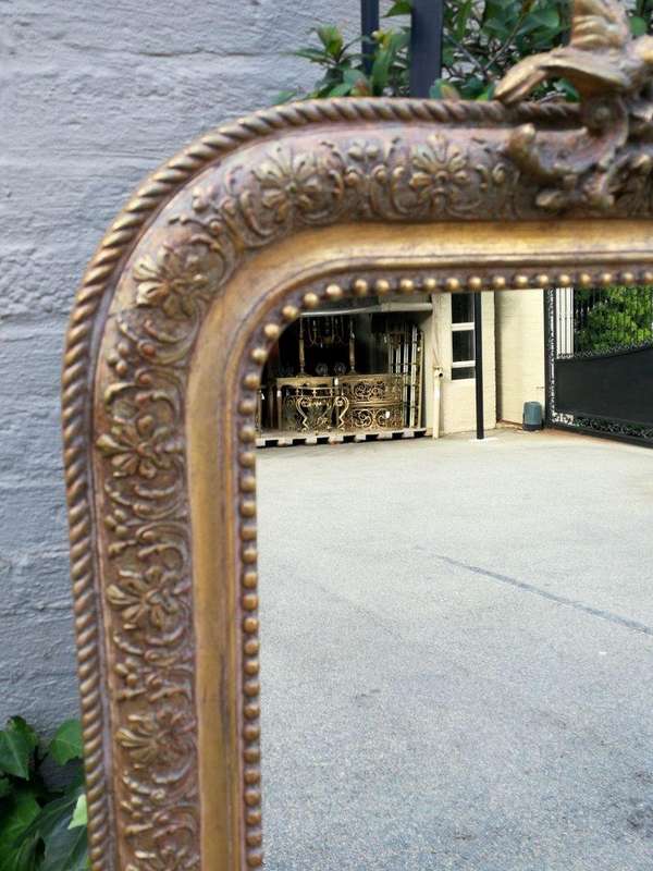 A French Gilt And Gesso Rococo Style Mirror, With Putti