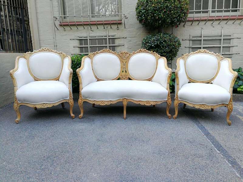 A French 20th Century Bleached / Stripped / Natural Walnut Bergére Settee and Pair of Armchairs