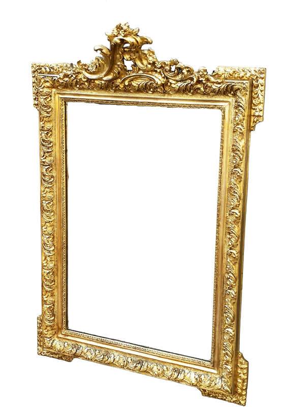 A Heavily Carved and Gilded Mirror ND