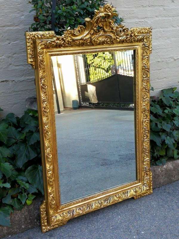 A Heavily Carved and Gilded Mirror ND
