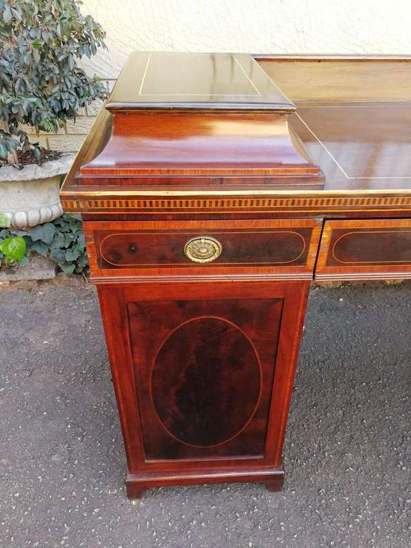 A Late Regency Inlaid Mahogany and Rosewood Pedestal Sideboard, fitted with original oval foliate...