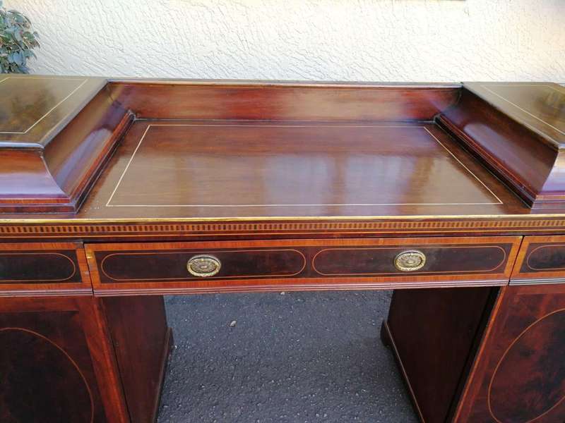 A Late Regency Inlaid Mahogany and Rosewood Pedestal Sideboard, fitted with original oval foliate...