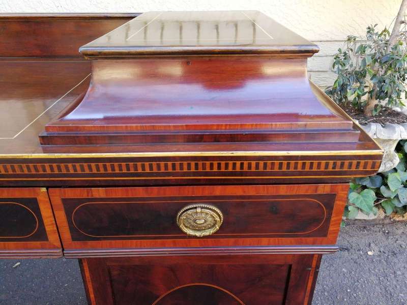 A Late Regency Inlaid Mahogany and Rosewood Pedestal Sideboard, fitted with original oval foliate...