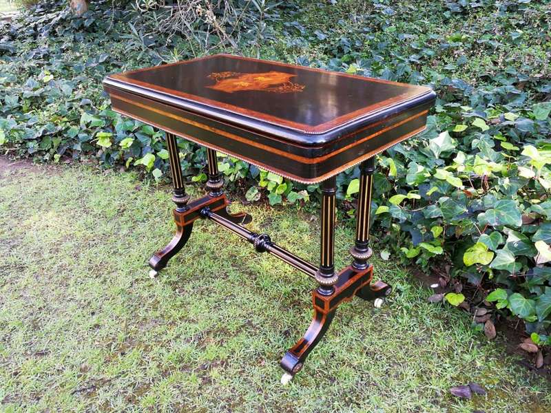 A Napoleon III Inlaid Ebony, Walnut and Ormolu Card / Stretcher Table