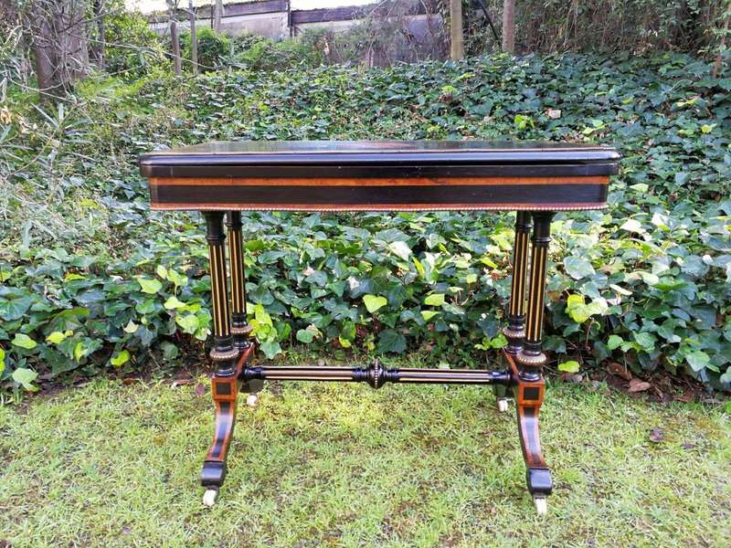 A Napoleon III Inlaid Ebony, Walnut and Ormolu Card / Stretcher Table