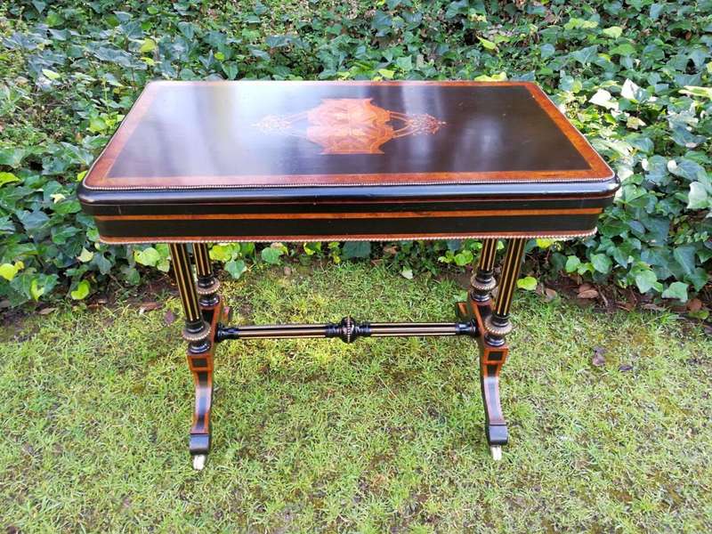 A Napoleon III Inlaid Ebony, Walnut and Ormolu Card / Stretcher Table
