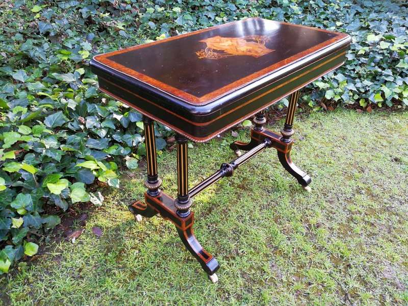 A Napoleon III Inlaid Ebony, Walnut and Ormolu Card / Stretcher Table